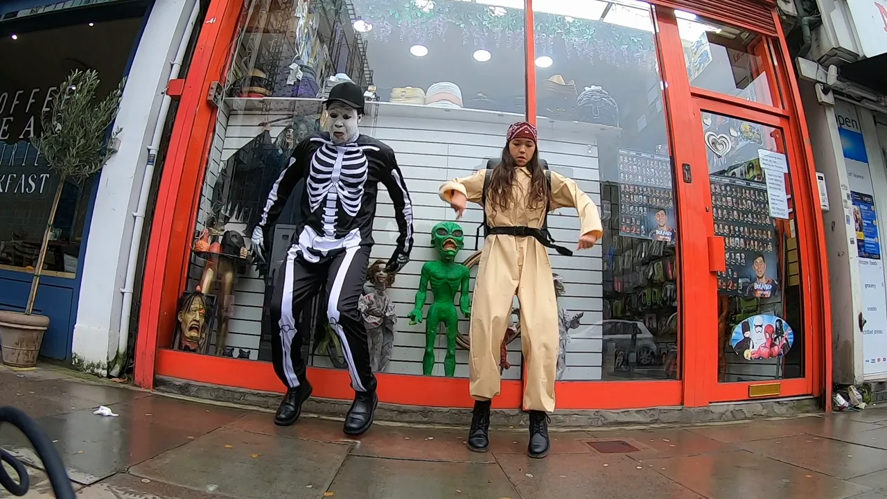 Costumed characters outside the red-fronted Carnival Store in London